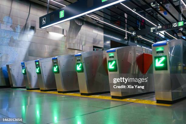 automatic fare gate in subway - entering turnstile stock pictures, royalty-free photos & images