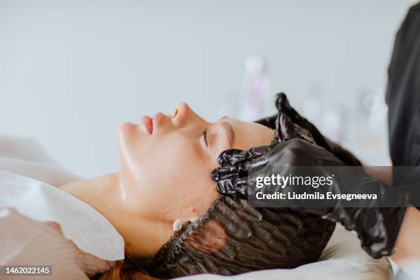 face massage by doctor's hands - aesthetic medicine stock pictures, royalty-free photos & images