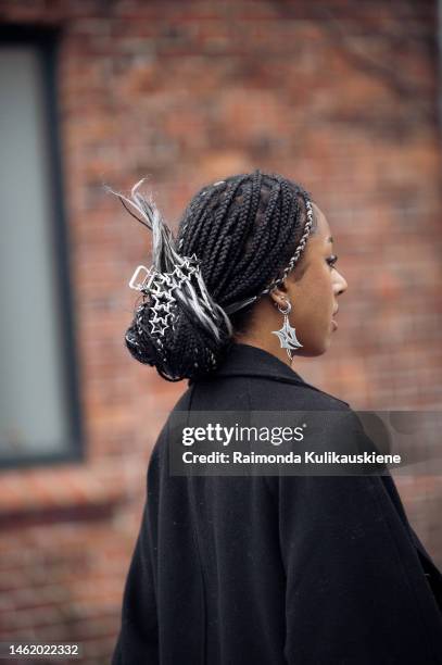 Guest wearing a black coat star shape hair accessory outside Selam Fessahaye, during the Copenhagen Fashion Week Autumn/Winter 2023 on February 01,...