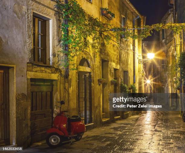 street in an old italian town in the night - grosseto province stock pictures, royalty-free photos & images