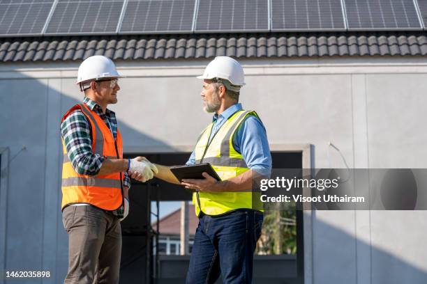 shake hands,architect with engineer meeting. - construction contract stock pictures, royalty-free photos & images