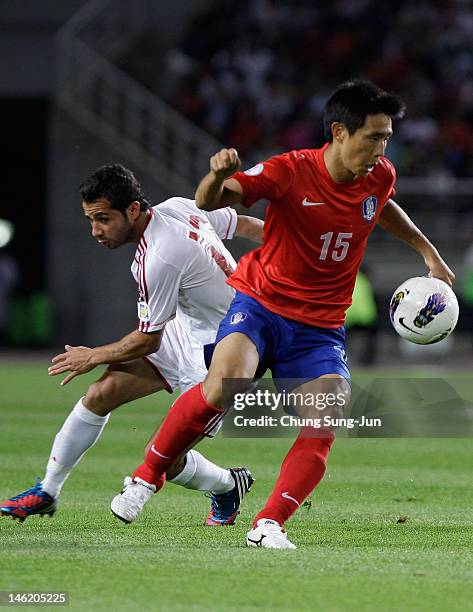 Oh Beom-Seok of South Korea tussles for posession with Hassan El Mohamad of Lebanon during the FIFA World Cup Asian Qualifier match between South...