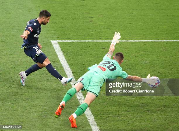 Bruno Fornaroli of the Victory shoots past Phoenix goalkeeper Oliver Sail to score during the round 15 A-League Men's match between Melbourne Victory...