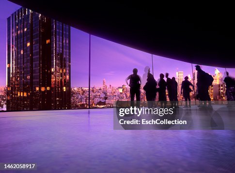 People watching projection of skyline of New York on a large curved screen