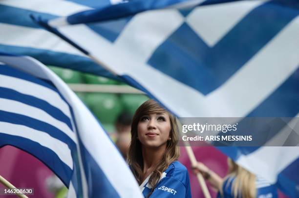 Greek fan holds a flag before the Euro 2012 championships football match Greece vs Czech Republic on June 12, 2012 at the Municipal Stadium in...