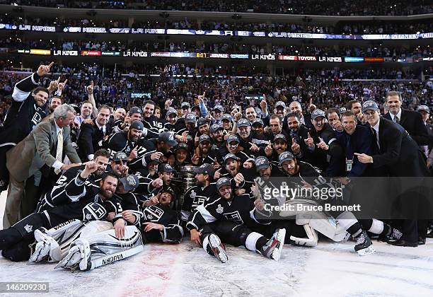 The Los Angeles Kings pose for a team shot with the Stanley Cup after the Kings defeated the New Jersey Devils 6-1 to win the Stanley Cup series 4-2...