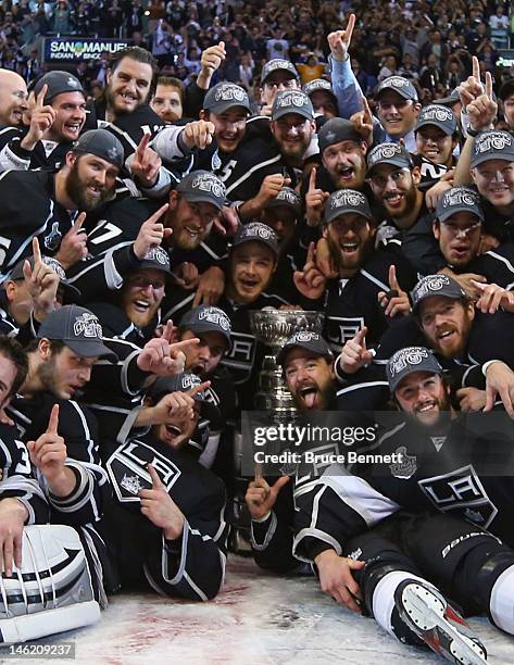 The Los Angeles Kings pose for a team shot with the Stanley Cup after the Kings defeated the New Jersey Devils 6-1 to win the Stanley Cup series 4-2...