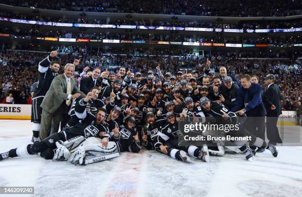 The Los Angeles Kings pose for a team shot with the Stanley Cup after the Kings defeated the New Jersey Devils 6-1 to win the Stanley Cup series 4-2...