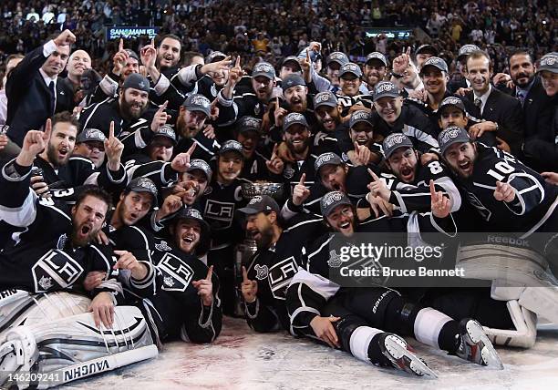 The Los Angeles Kings pose for a team shot with the Stanley Cup after the Kings defeated the New Jersey Devils 6-1 to win the Stanley Cup series 4-2...