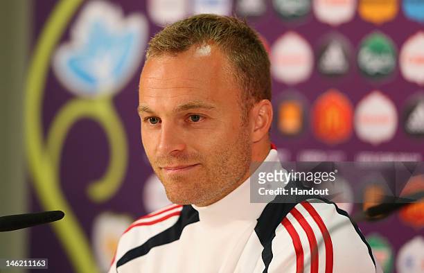 In this handout image provided by UEFA, Lars Jacobsen of Denmark talks to the media during a UEFA EURO 2012 press conference at the Arena Lviv on...