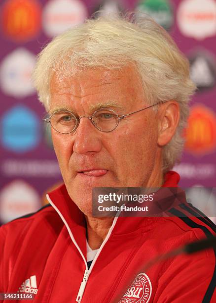 In this handout image provided by UEFA, Morten Olsen the coach of Denmark talks to the media during a UEFA EURO 2012 press conference at the Arena...