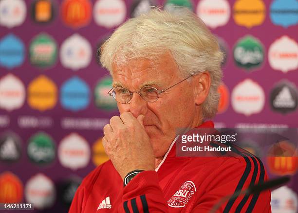 In this handout image provided by UEFA, Morten Olsen the coach of Denmark talks to the media during a UEFA EURO 2012 press conference at the Arena...