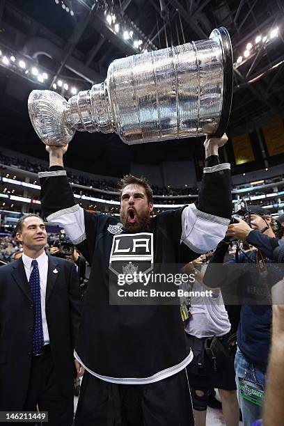 Willie Mitchell of the Los Angeles Kings holds up the Stanley Cup after the Kings defeated the New Jersey Devils 6-1 to win the Stanley Cup series...