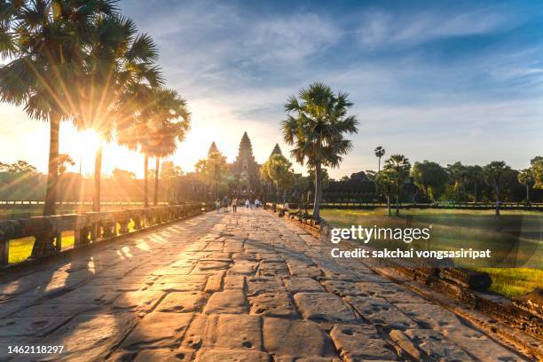 scenic view of angkor wat against sky during sunrise - angkor wat stock-fotos und bilder