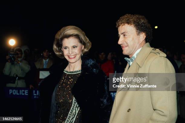 Cyd Charisse and Danny Thomas sit beside each other at an event, circa 1990s.