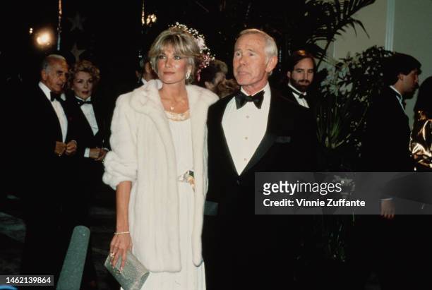 Johnny Carson and Alexis Mass during AFI Lifetime Achievement Award to Billy Wilder at Beverly Hilton Hotel in Beverly Hills, California, United...