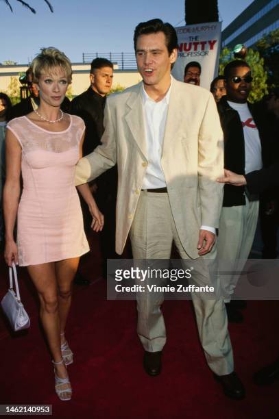 Lauren Holly and Jim Carrey attend "The Nutty Professor" Universal City premiere at the Universal Amphitheatre in Universal City, California, United...