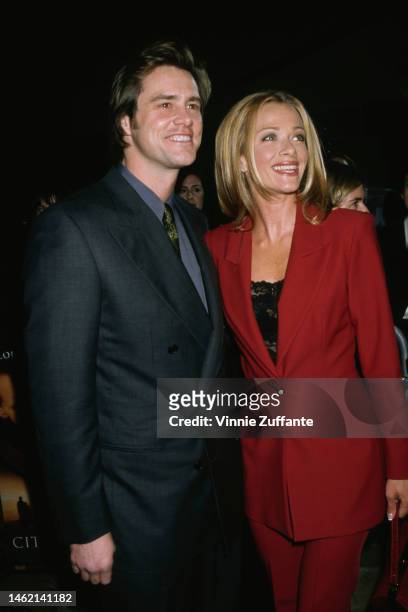 Lauren Holly and Jim Carrey during "Ace Ventura When Nature Calls" Westwood Premiere at Mann Village Theatre in Westwood, California, United States,...