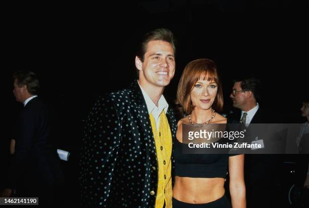 Jim Carrey and Lauren Holly during "The Mask" Los Angeles Premiere at Academy of Motion Picture Theater in Beverly Hills, California, United States,...