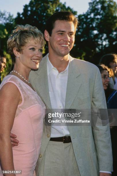 Lauren Holly and actor Jim Carrey attend "The Nutty Professor" Universal City Premiere at the Universal Amphitheatre in Universal City, California,...