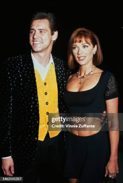 Jim Carrey and Lauren Holly during "The Mask" Los Angeles Premiere at Academy of Motion Picture Theater in Beverly Hills, California, United States,...