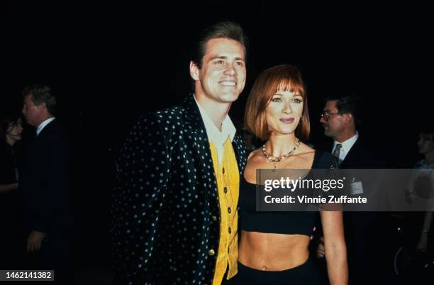 Jim Carrey and Lauren Holly during "The Mask" Los Angeles Premiere at Academy of Motion Picture Theater in Beverly Hills, California, United States,...