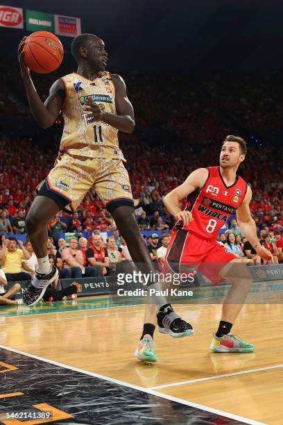 Lat Mayen of the Taipans keeps the ball in play during the round 18 NBL match between Perth Wildcats and Cairns Taipans at RAC Arena, on February 03...