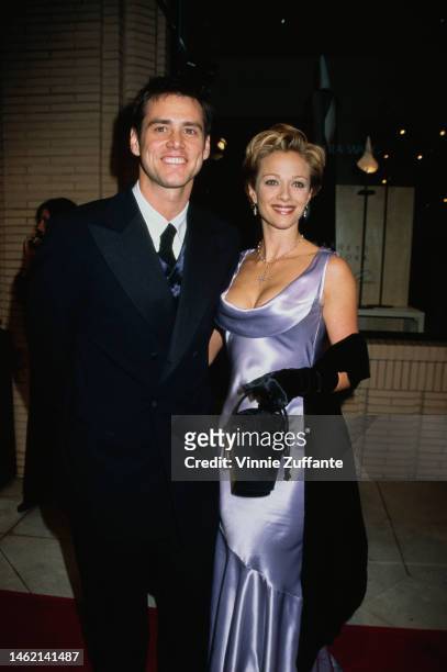 Jim Carrey and actress Lauren Holly attend 6th Annual Fire & Ice Ball to Benefit the Revlon/UCLA Women's Cancer Research Program at Barney's New York...