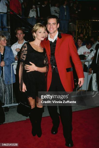 Lauren Holly and Jim Carrey during "Ace Ventura When Nature Calls" Westwood Premiere at Mann Village Theatre in Westwood, California, United States,...