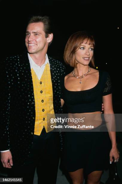 Jim Carrey and Lauren Holly during "The Mask" Los Angeles Premiere at Academy of Motion Picture Theater in Beverly Hills, California, United States,...
