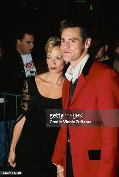 Jim Carrey & Lauren Holly during 'Ace Ventura' premiere at Mann Village Theatre in Westwood, California, United States, 8th November 1995.