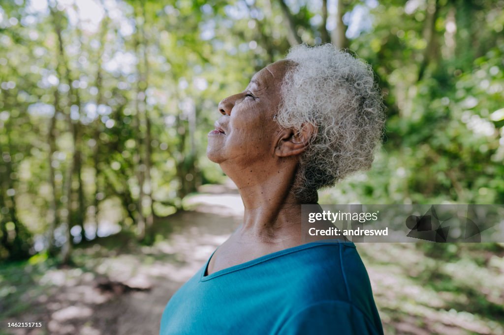Portrait of a senior woman breathing fresh air