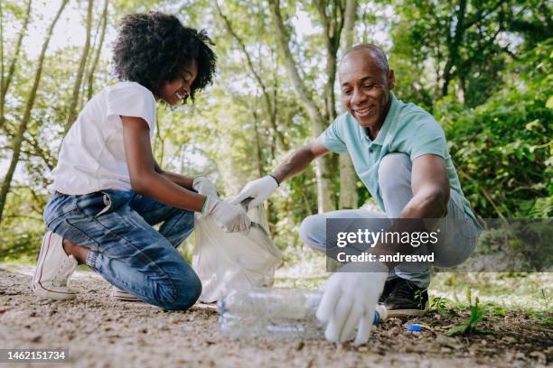 Black Man Picking Up Trash In Own Yard Black Man Picking Up Trash Photos and Premium High Res Pictures - Getty
