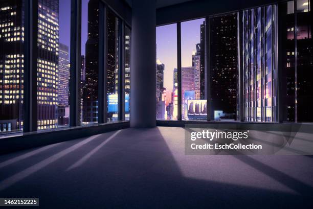 empty office or apartment with view of times square in new york at sunset - grand plans for new home stockfoto's en -beelden