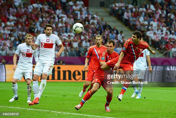 Alan Dzagoev of Russia heads the ball to score the first goal during the UEFA EURO 2012 group A match between Poland and Russia at The National...