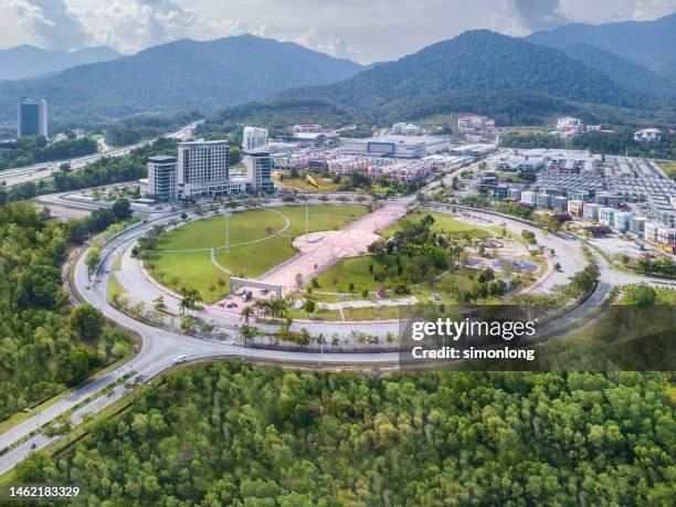 drone view of cityscape with open  park and modern skyscrapers - perak state stock pictures, royalty-free photos & images