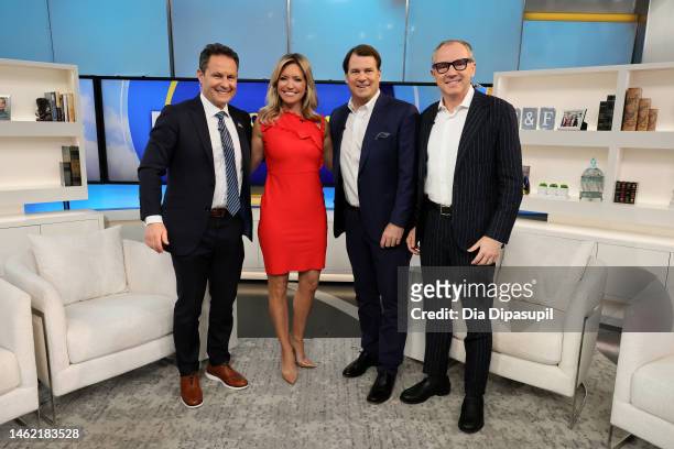 Brian Kilmeade, Ainsley Earhardt, Ford CEO Jim Farley, and F1 CEO Stefano Domenicali pose during "FOX & Friends" at Fox News Channel Studios on...