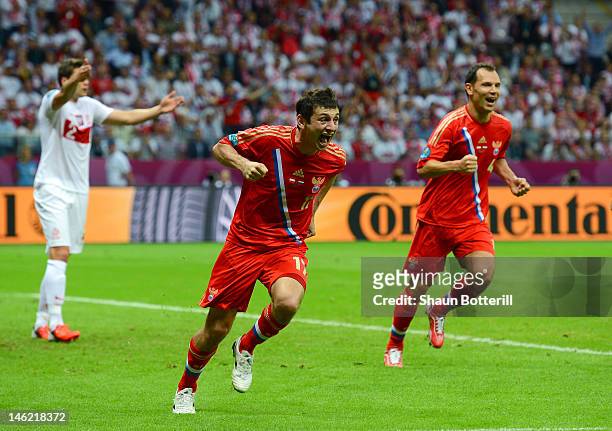 Alan Dzagoev of Russia celebrates scoring the first goal during the UEFA EURO 2012 group A match between Poland and Russia at The National Stadium on...