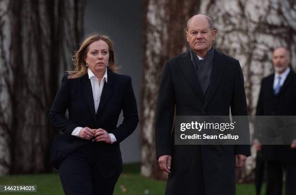 German Chancellor Olaf Scholz and Italian Prime Minister Giorgia Meloni prepare to review a guard of honour upon Meloni's arrival at the Chancellery...