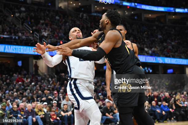 Dillon Brooks of the Memphis Grizzlies fights with Donovan Mitchell of the Cleveland Cavaliers during the third quarter of the game at Rocket...