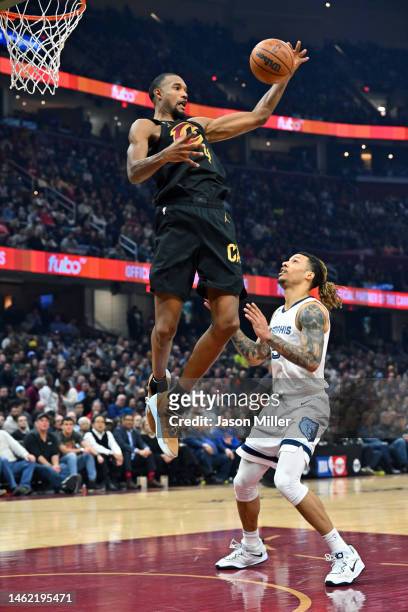 Evan Mobley of the Cleveland Cavaliers rebounds over Brandon Clarke of the Memphis Grizzlies during the first quarter of the game of the game at...