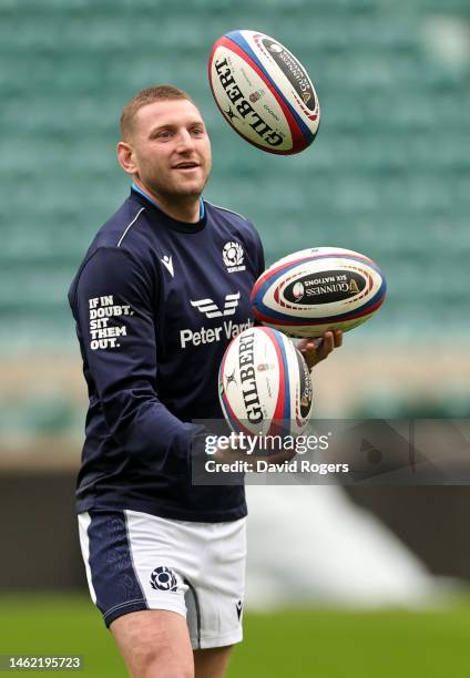 Finn Russell juggles rugby balls during the Scotland captain's run at Twickenham Stadium on February 03, 2023 in London, England.