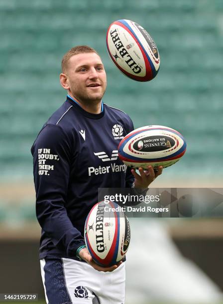 Finn Russell juggles rugby balls during the Scotland captain's run at Twickenham Stadium on February 03, 2023 in London, England.