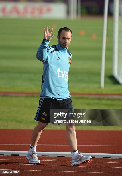 Andres Iniesta of Spain greets his fans as he arrives for a training session during the UEFA EURO 2012 championship on June 12, 2012 in Gniewino,...