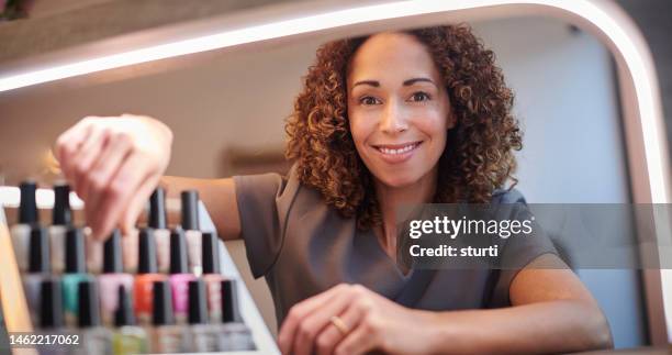 nail technician portrait - nail salon stock pictures, royalty-free photos & images