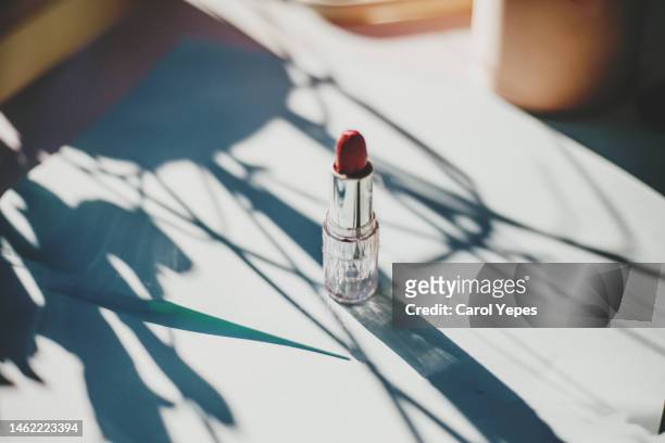 lipstick on white surface casting shadows - make up table stock pictures, royalty-free photos & images
