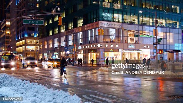 winter in new york. snow, 42nd street. manhattan - snösörja bildbanksfoton och bilder