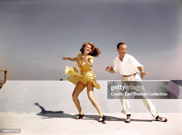 Acors and dancers Rita Hayworth and Fred Astaire rehearse on a roof top at Columbia Pictures for a scene from their film 'You Were Never Lovelier' in...