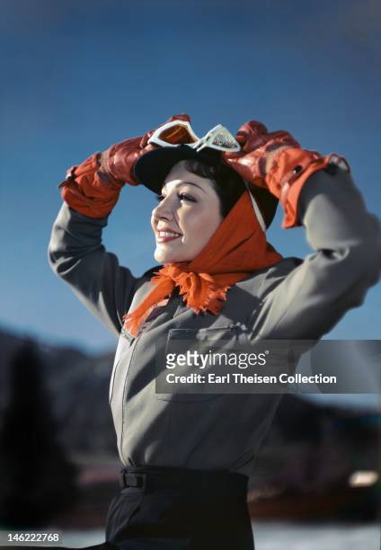 Actress Claudette Colbert poses for a portrait while skiing circa 1948 in Sun Valley, Idaho.