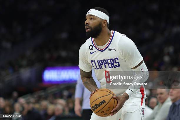 Marcus Morris Sr. #8 of the LA Clippers handles the ball during a game against the Milwaukee Bucks at Fiserv Forum on February 02, 2023 in Milwaukee,...